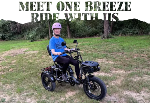 An older adult in a pink helmet sits on the Meet One Breeze Folding Electric Trike outdoors on grass with trees behind, and "Meet Our E-Biker" text above.