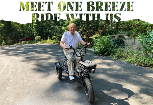 An older man rides a Meet One Breeze Folding Electric Trike on a paved driveway surrounded by greenery. Large text above reads, “MEET ONE BREEZE WITH ME.”.