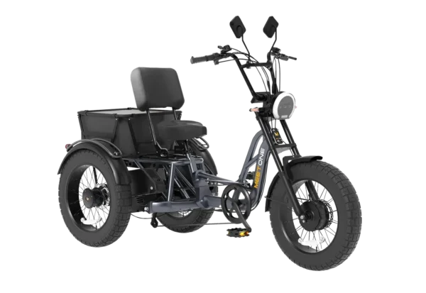 The Meet One Tour Dual Motor Dual Battery Electric Trike features three wheels, a black frame, large tires, a padded seat with backrest, and a storage compartment behind the seat.
