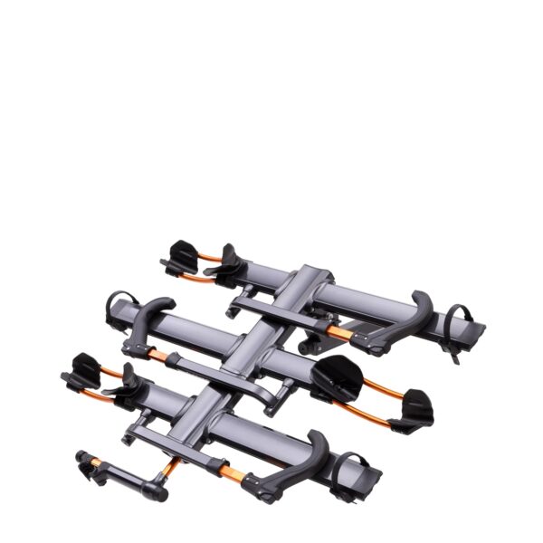 The NV™ 2.0 is a folded metal bike rack with black and orange components, designed to hold two bicycles, shown against a white background.
