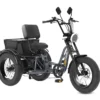 The Meet One Tour Lite Full Suspension Electric Trike features a black frame, large tires, a wide seat with backrest, rear cargo box, handlebars with mirrors, and a front headlight.