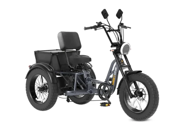 The Meet One Tour Lite Full Suspension Electric Trike features a black frame, large tires, a wide seat with backrest, rear cargo box, handlebars with mirrors, and a front headlight.