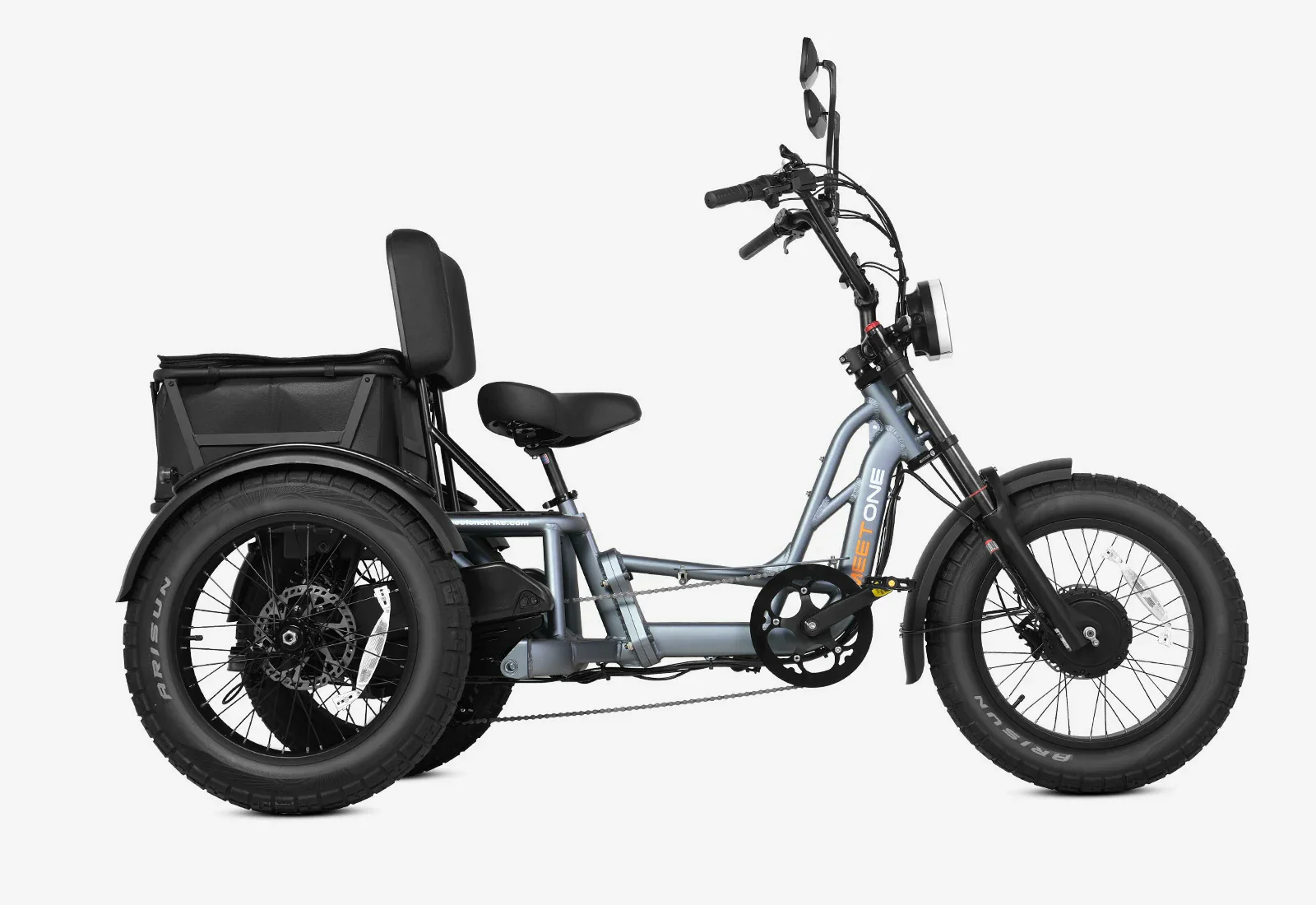 Electric tricycle with a padded seat, backrest, rear cargo basket, and fat tires, shown from the side against a white background.
