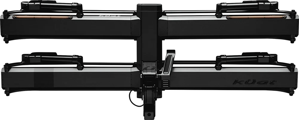 A black Kuat bike rack with two horizontal trays and adjustable arms, viewed from the rear against a white background.