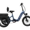 A blue electric tricycle with a rear storage basket, step-through frame, front headlight, and a padded seat with backrest, shown on a white background.