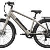 The Mesa Lite Ebike is a beige electric bicycle with a black seat, rear rack, and front and rear fenders, shown from the side on a white background.