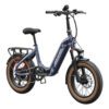 The Slate Ebike is a blue foldable electric bike featuring wide tan tires, a rear cargo rack, front suspension, and "NOWWHEEL" branding on the frame, pictured against a white background.