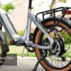Close-up of the Slate Ebike's rear wheel and frame, showcasing its silver finish, hydraulic disc brakes, and rear cargo rack.