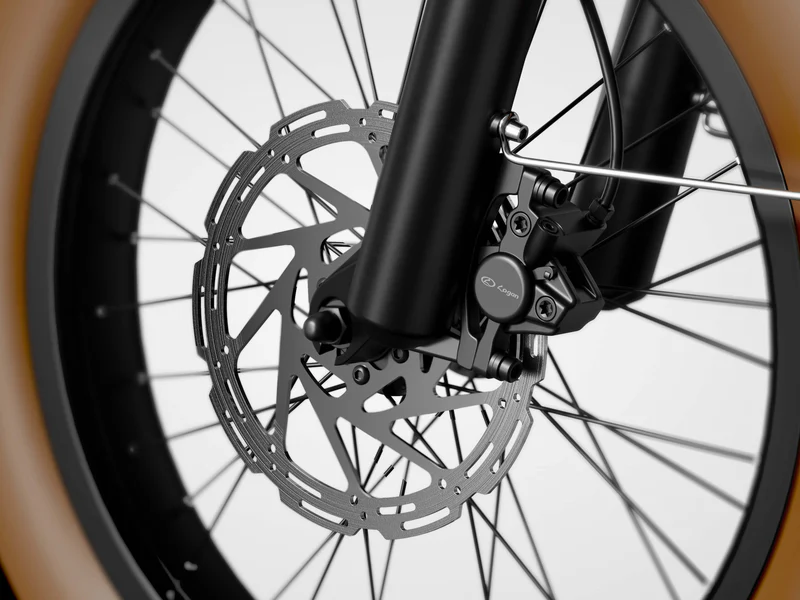 Close-up of a bicycle front wheel showing the disc brake, caliper, spokes, and part of a brown tire against a white background.
