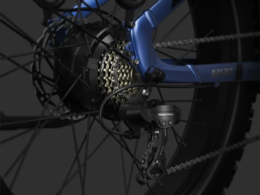 Close-up of a bicycle's rear derailleur and gear cassette, showing the chain, spokes, and part of the blue bike frame.