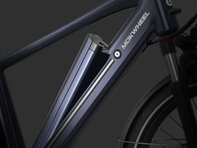 Close-up of a Mokwheel electric bicycle frame with an integrated battery mounted diagonally on the down tube, shown against a dark background.