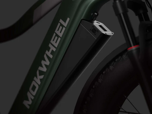 Close-up of a Mokwheel electric bicycle frame, highlighting the integrated battery mounted on the down tube.