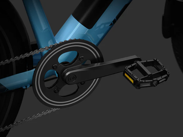 Close-up view of a black bicycle crankset and pedal attached to a blue bike frame, with part of the chain and rear wheel visible.
