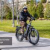 A person in a helmet and jacket rides the Tor Plus Ebike along a park path; a caption reads "Up to 60 Mile Range.