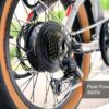 Close-up of the Slate Ebike’s rear wheel, displaying the motor, gears, derailleur, and tire. A label shows “Peak Power 860W.”.