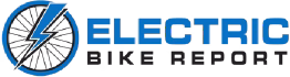Logo for Electric Bike Report, featuring a stylized bicycle wheel with a blue lightning bolt and the text "ELECTRIC BIKE REPORT" in blue and black letters.