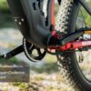 Close-up of the Obsidian Ebike's pedal and crank system labeled "Torque+Cadence Sensor," showcasing the chain, rear tire, and frame.