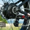 Close-up of the Obsidian Ebike’s rear wheel featuring its Shimano 8-speed gear system and derailleur.