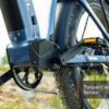 Close-up of the Basalt Ebike's pedal and motor area outdoors, showcasing the integrated torque and cadence sensor with a small overlay label.