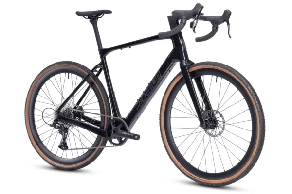 The CF Racer1 is a black gravel bike with drop handlebars, disc brakes, wide tan wall tires, and a carbon frame, displayed against a white background.