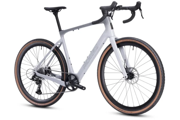 The CF Racer1 is a modern gravel bike featuring a white frame, drop handlebars, disc brakes, and wide tan-walled tires, displayed against a plain white background.