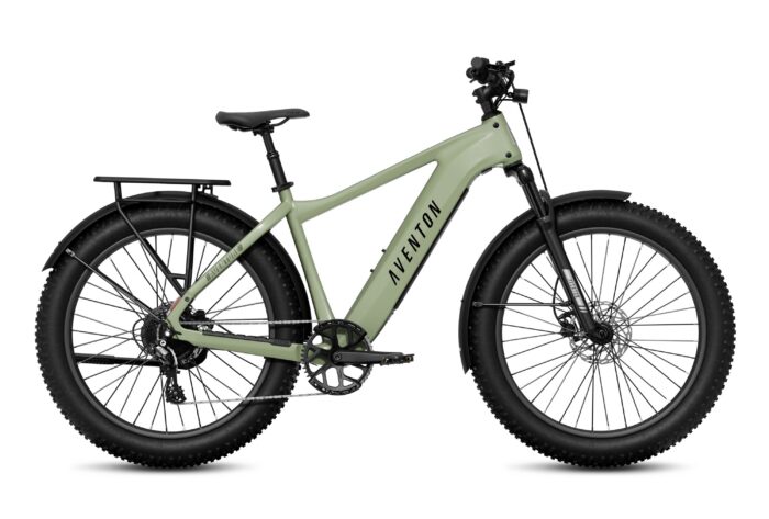 Sage green Aventon electric mountain bike with thick tires, a rear rack, and fenders.