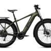 Olive green Aventon Aventure electric fat-tire bike with a rear rack and front suspension.