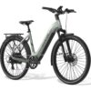 Light green Aventon step-through electric commuter bike with a rear rack, fenders, and disc brakes.
