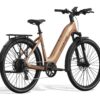 Aventon step-through electric commuter bike in metallic copper with a rear cargo rack and fenders.
