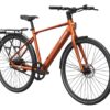 Orange Mokwheel electric commuter bike with a rear rack, fenders, and disc brakes.