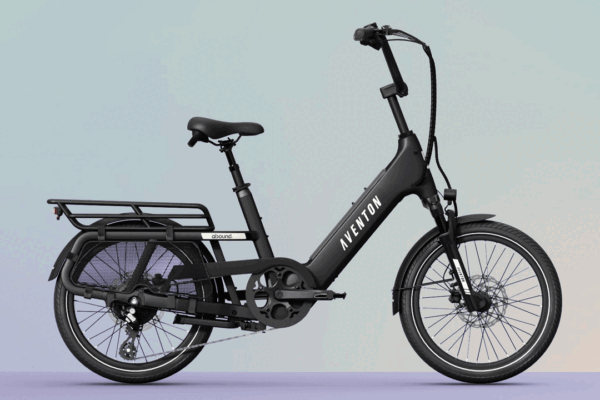 Black Aventon Abound electric cargo bike with a rear rack, step-through frame, and small wheels.