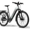 Light green Aventon electric step-through bicycle with a rear rack, fenders, and black tires.