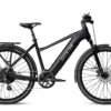 Black Aventon step-through electric commuter bike with a rear rack and fenders.