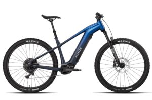Blue Aventon electric mountain bike with knobby tires and front suspension.