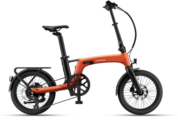 An orange Urtopia folding electric bike with a rear rack, black handlebars, and black wheels.