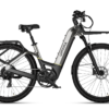 Urtopia electric bike in dark grey with a step-through frame, front and rear cargo racks, and knobby tires.