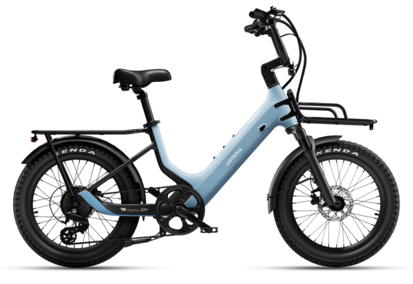 Light blue Urtopia e-bike with a step-through frame, front and rear racks, and knobby tires.