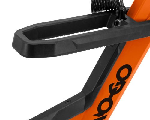 Close-up of a black bike lock holder attached to an orange bike frame. A coiled cable lock is secured within the holder.